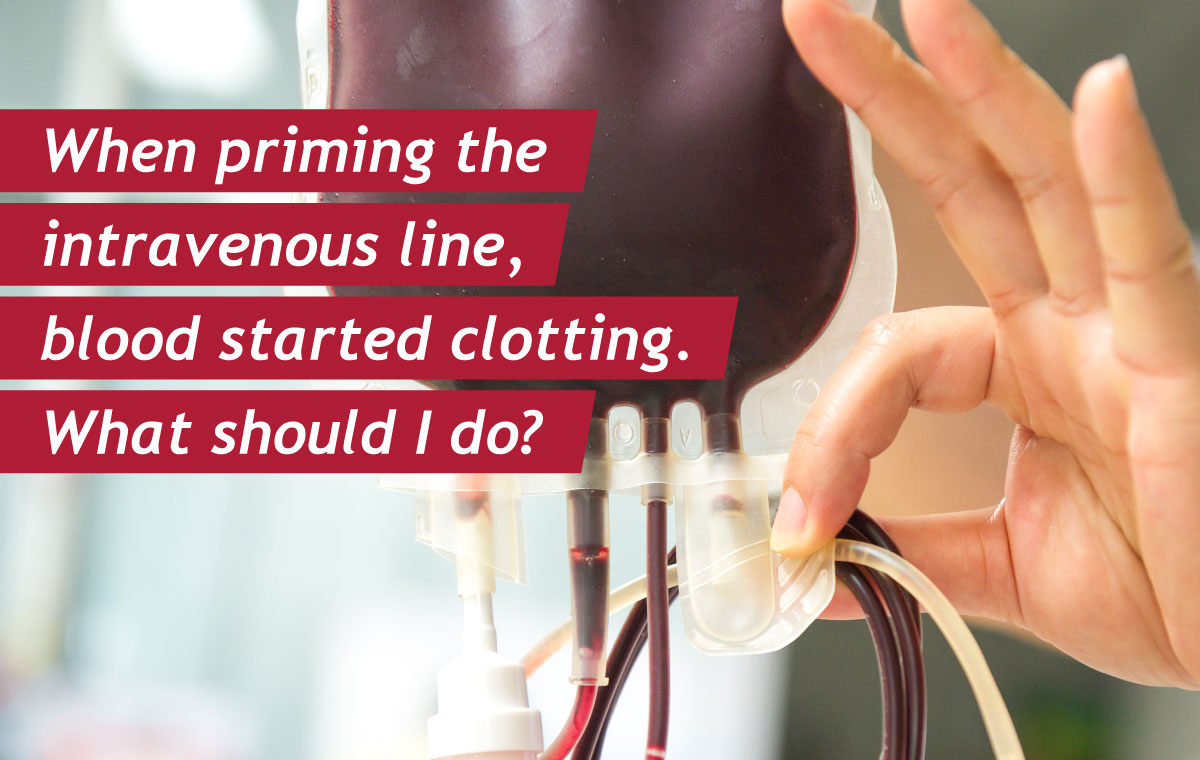 When priming the intravenous line, blood started clotting. What should I do?